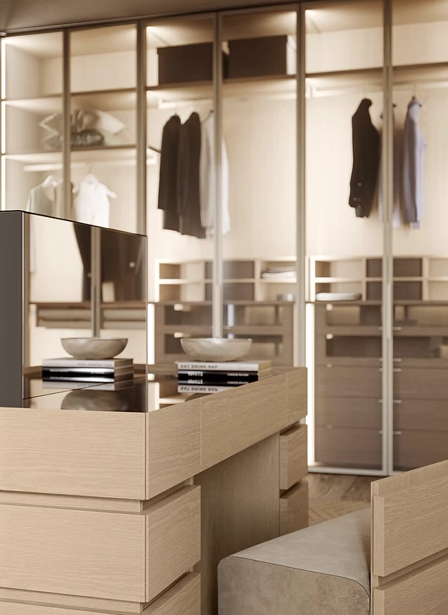 Close-up of a custom Italian wardrobe featuring soft-close drawers, glass-fronted displays, and warm wood interiors.