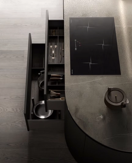 Arkè Shape technical detail - Aerial view of an organic curved island featuring a stone-effect worktop with integrated induction cooktop and bespoke internal drawer organization.